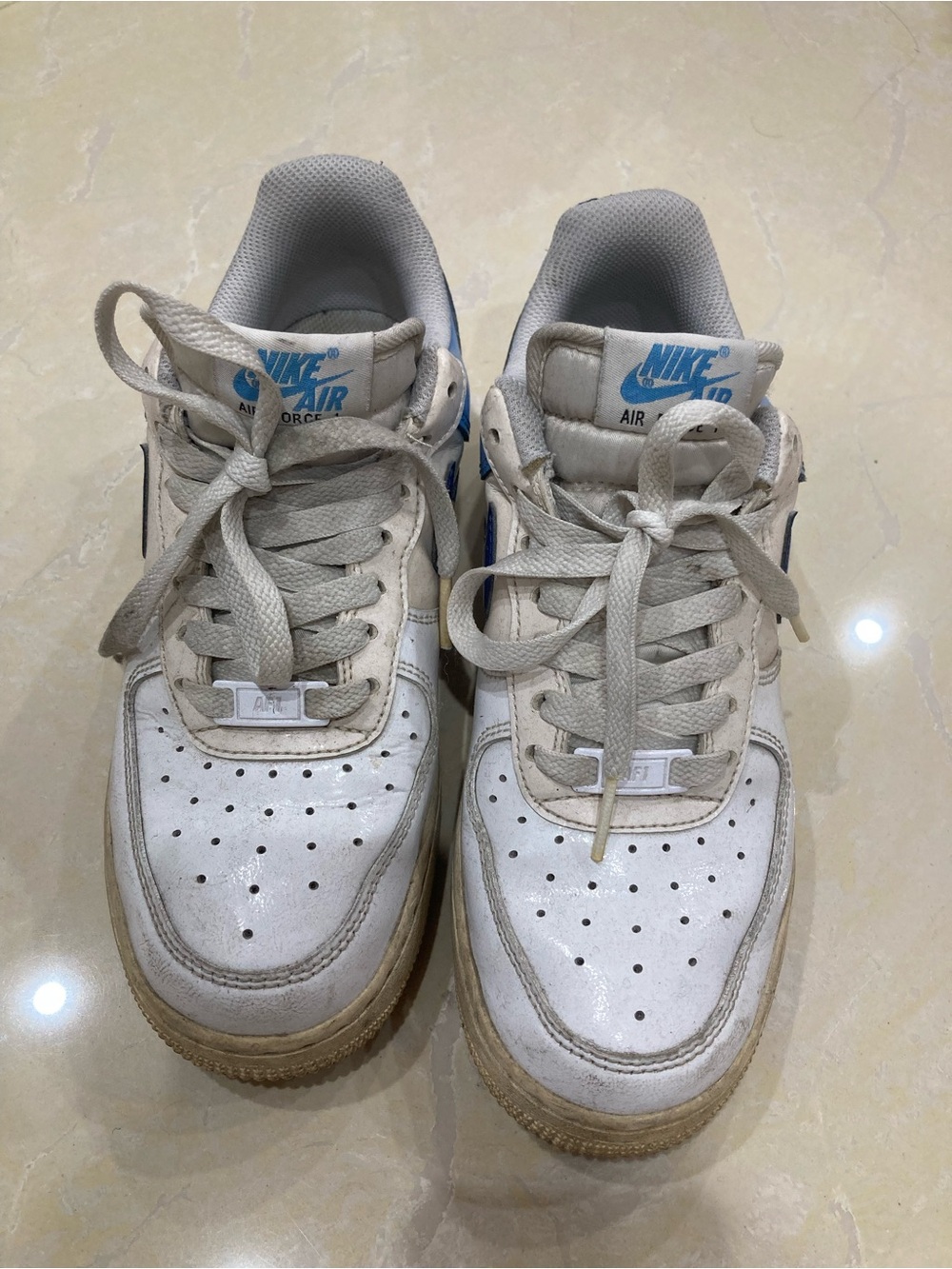 Nike White Sneakers with Blue Logo Accents